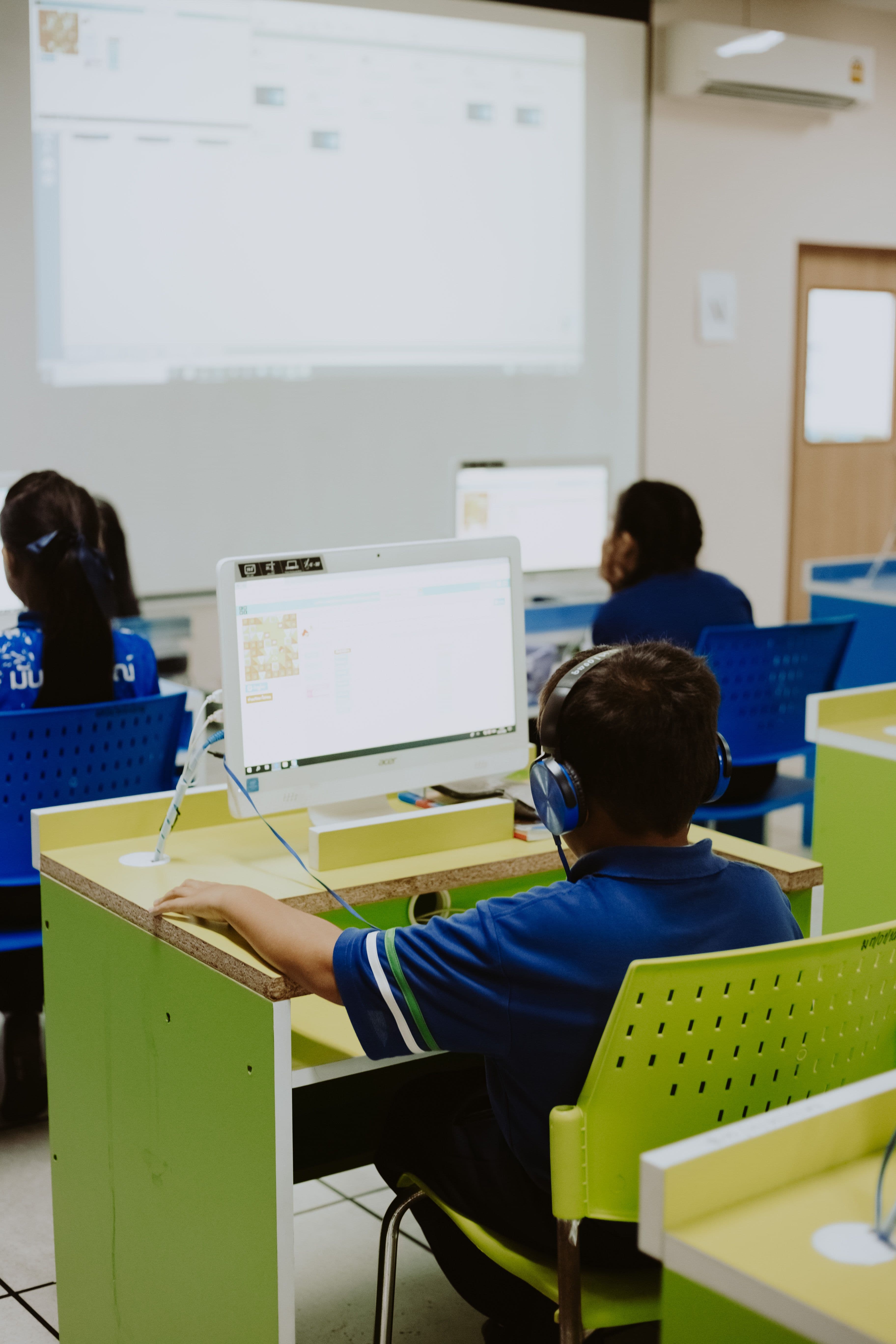 Students learning on computers in a modern classroom