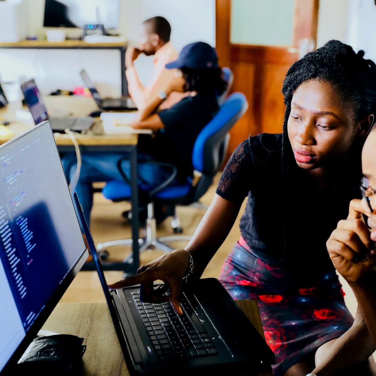 Engineers collaborating at a shared workspace